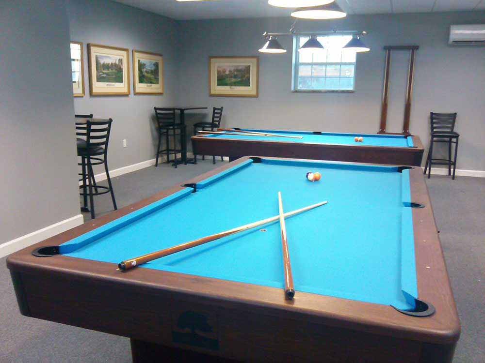 Two pool tables in the rec room at RALEIGH OAKS RV RESORT & COTTAGES