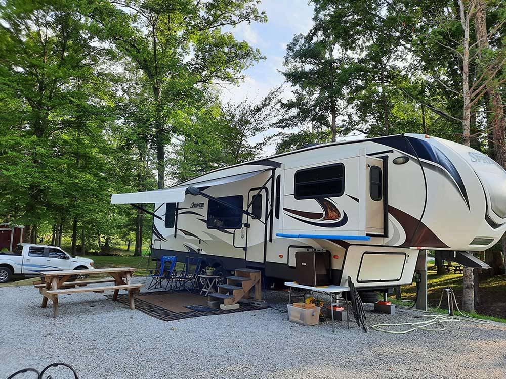 Fifth wheel towable parked onsite at COLUMBUS WOODS-N-WATERS KAMPGROUND