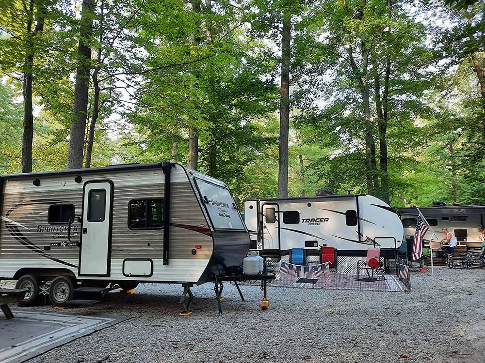 RVs set up for camping at COLUMBUS WOODS-N-WATERS KAMPGROUND