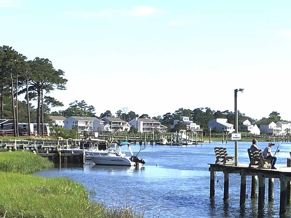 Boats docked on a pier at TOM'S COVE PARK