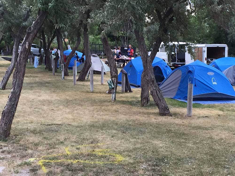 People camping with tents at SNAKE RIVER RV PARK AND CAMPGROUND