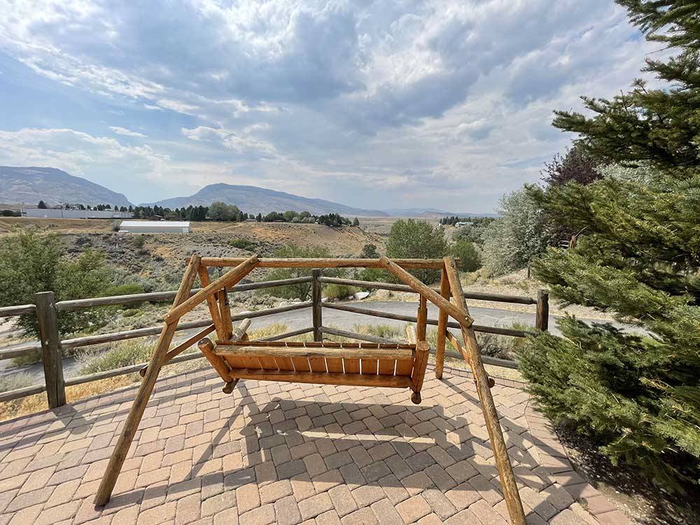 Rocking bench overlooking majestic views at PONDEROSA CAMPGROUND