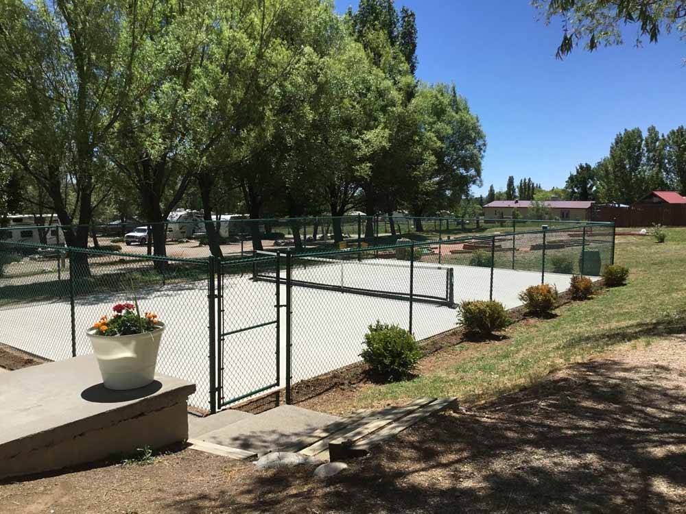 The fenced in pickleball court at OASIS DURANGO RV RESORT