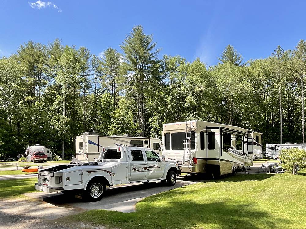 A fifth wheel trailer parked in a RV site at FIELD & STREAM RV PARK