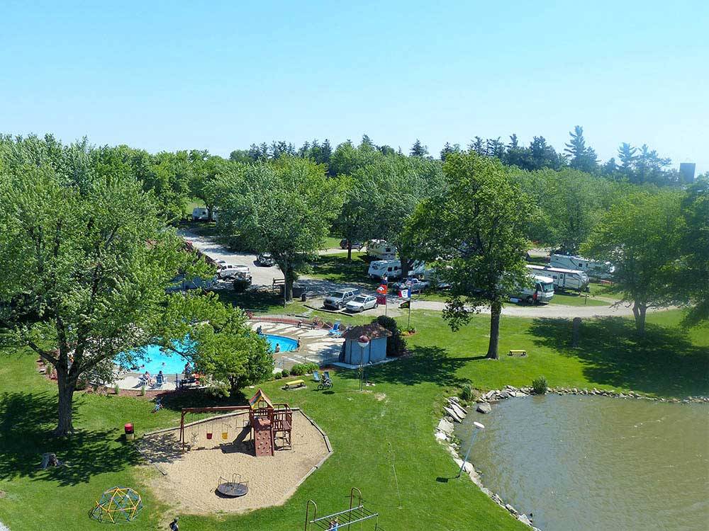 Swimming pool and playground by the lake at campground at BEYONDER GETAWAY AT SLEEPY HOLLOW