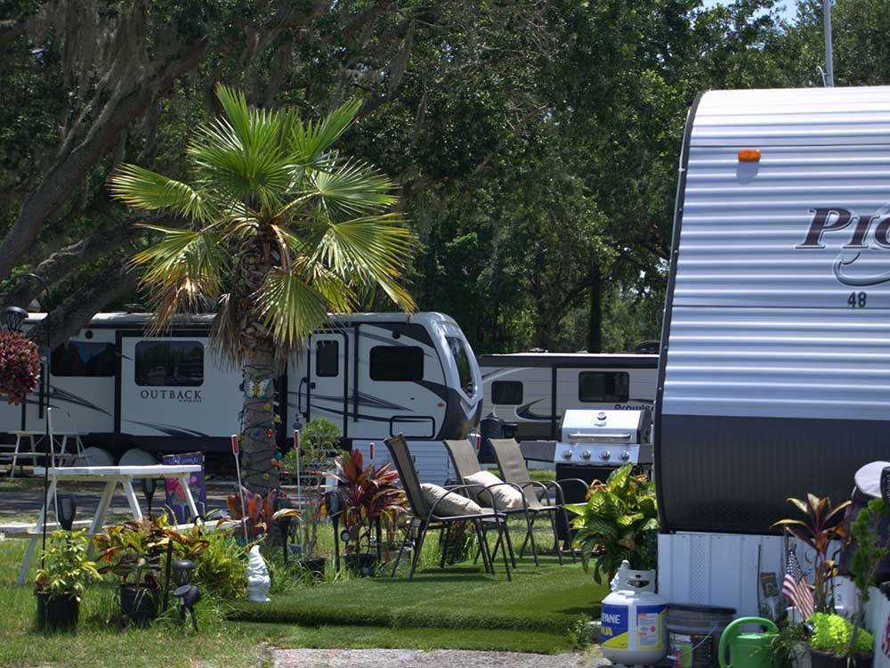 RV spots decorated with lawn items at KISSIMMEE RV PARK