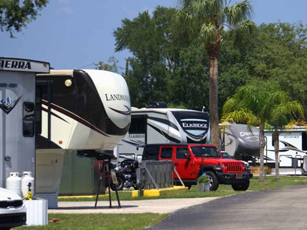 RVs lined up at campsites at KISSIMMEE RV PARK