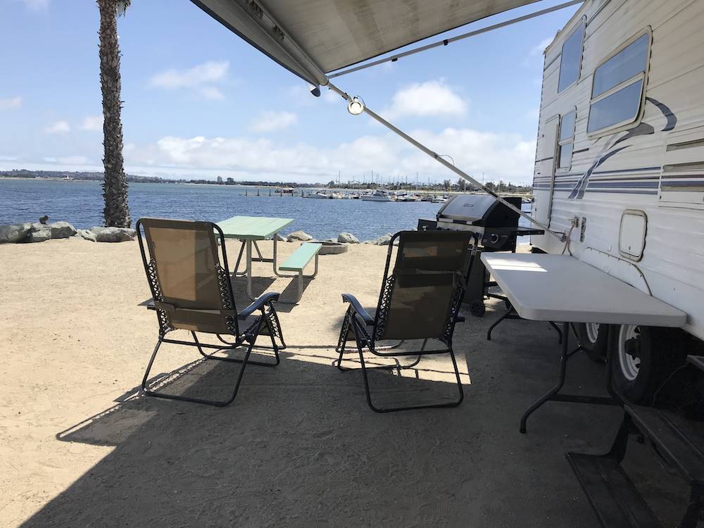 Outdoor seating overlooking the bay at CAMPLAND ON THE BAY