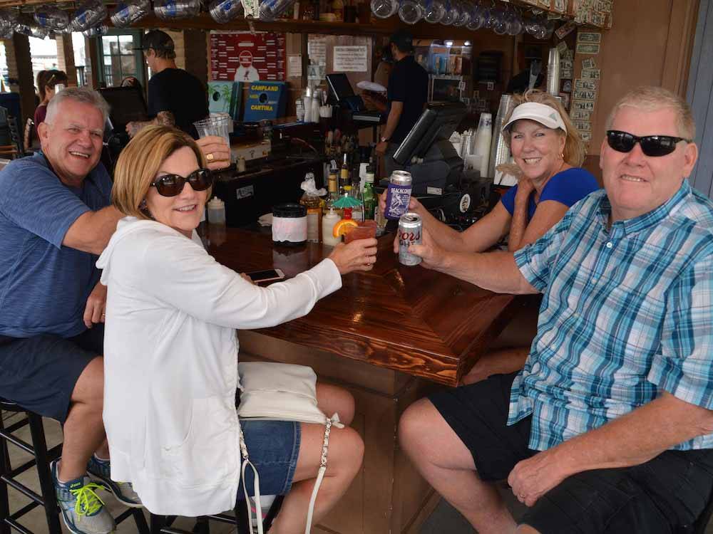 A group of adults drinking at CAMPLAND ON THE BAY