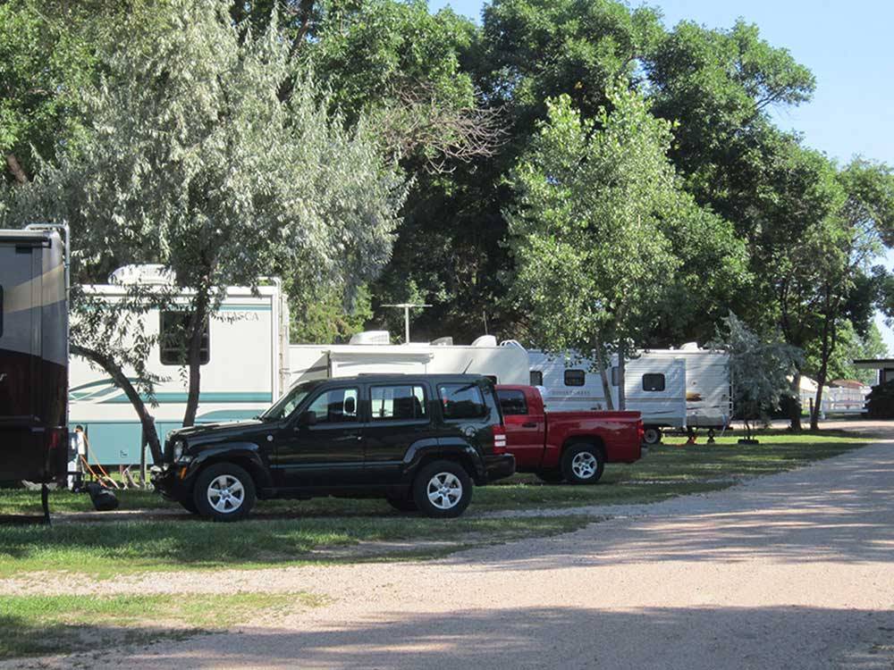 Trailers camping at campsite at HOLIDAY RV PARK & CAMPGROUND
