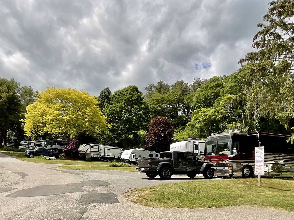 A row of paved RV sites at CAPE ANN CAMP SITE
