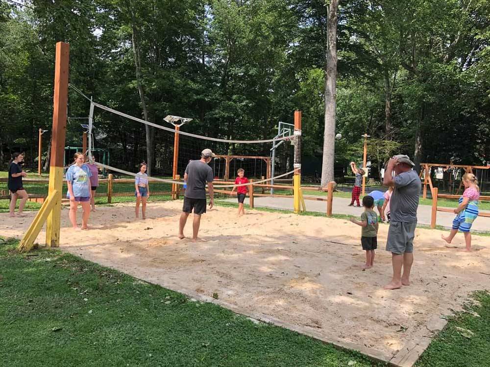 Campers playing volleyball at STONEBRIDGE RV RESORT