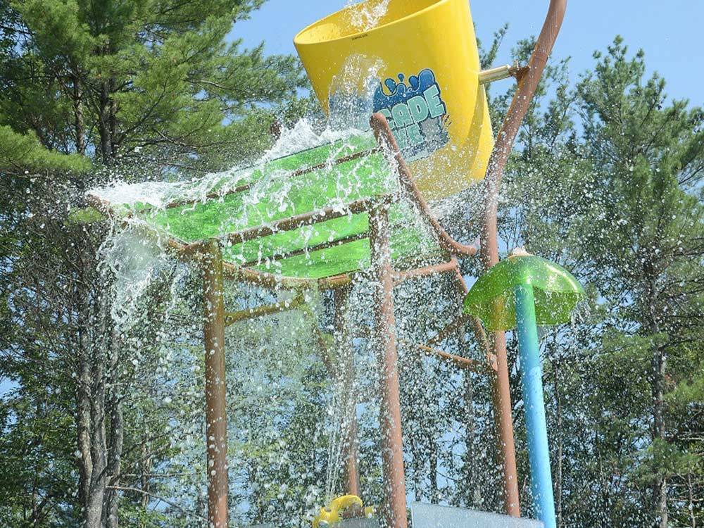 Giant colorful splash bucket pouring water down at LAKE GEORGE RV PARK