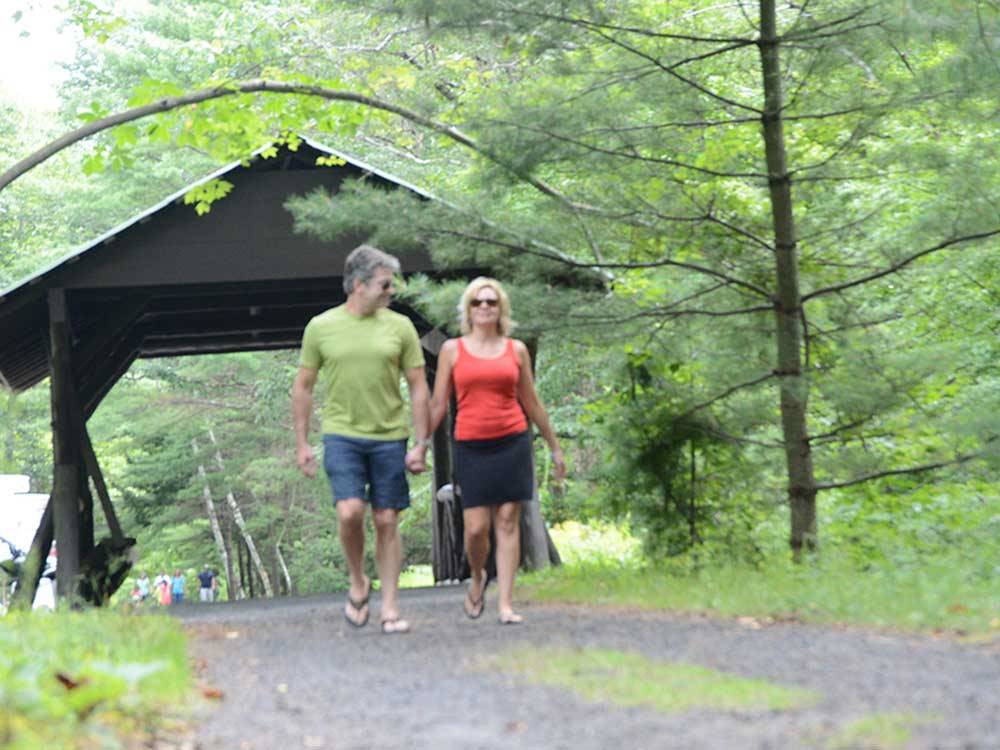 Couple walking in the park at LAKE GEORGE RV PARK