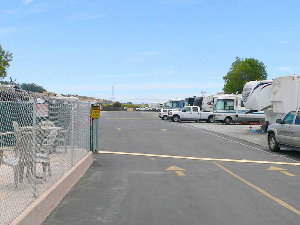RVs and truck and trailers parked in lot at MARIN RV PARK