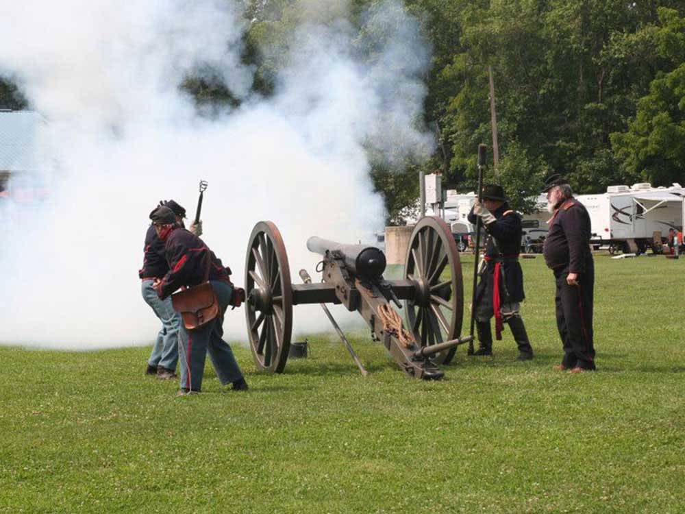 Men firing a cannon at the battlefield at GETTYSBURG CAMPGROUND