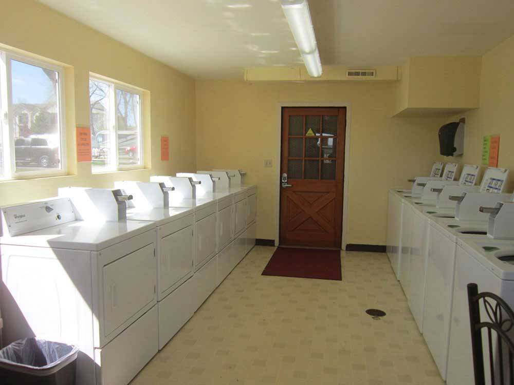 Laundry room with washer and dryers at LOVELAND RV RESORT