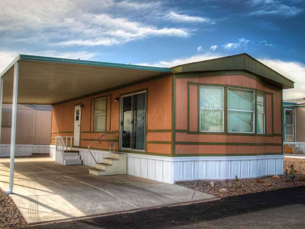 Exterior of cabin with deck at PICACHO PEAK RV RESORT