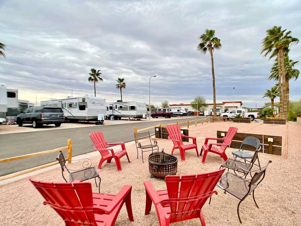 A fire pit with chairs at MESA SUNSET RV RESORT