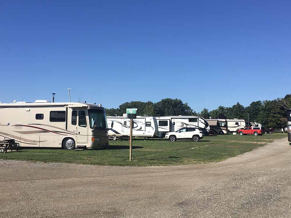 A group of RVs in the grass at WAYNE COUNTY FAIRGROUNDS RV PARK
