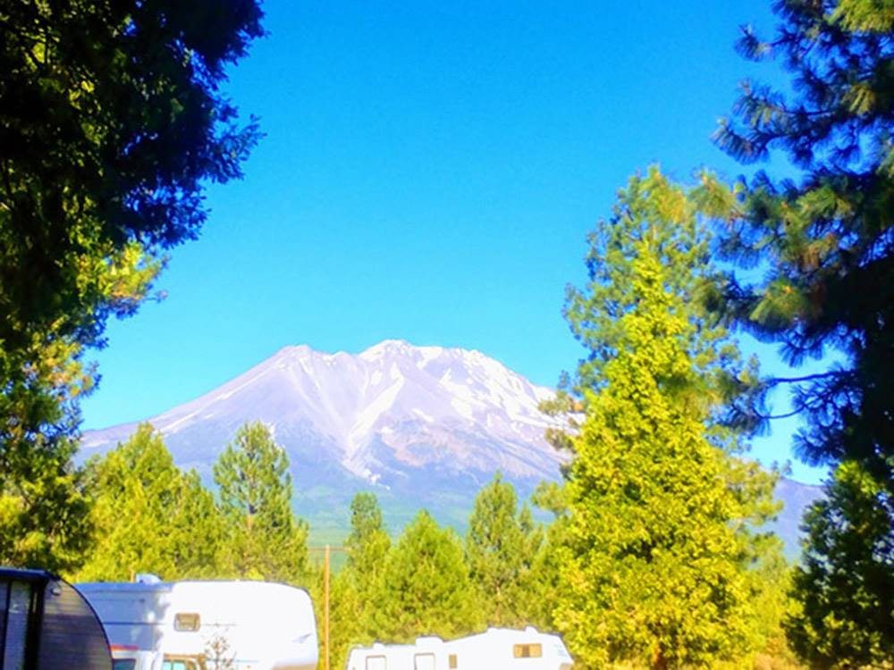 Mountain looms over RVs in camp at FRIENDLY RV PARK