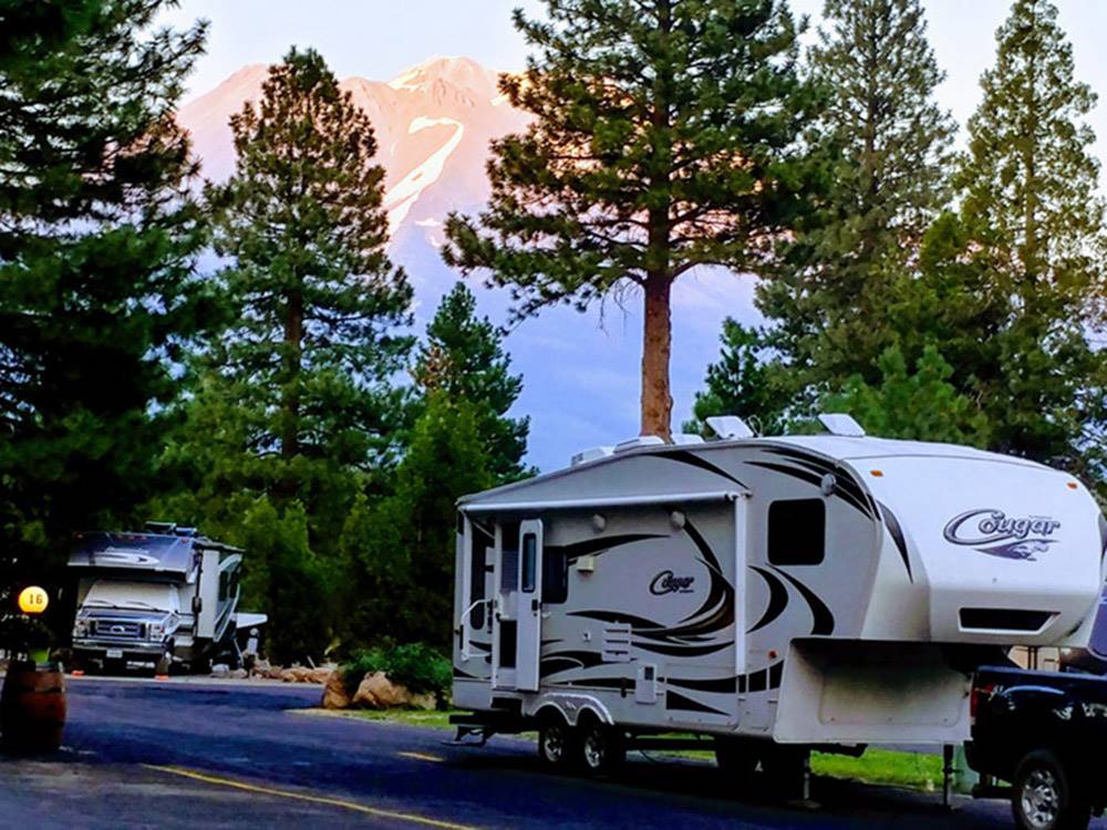 Fifth-wheel towed by black pickup truck at FRIENDLY RV PARK