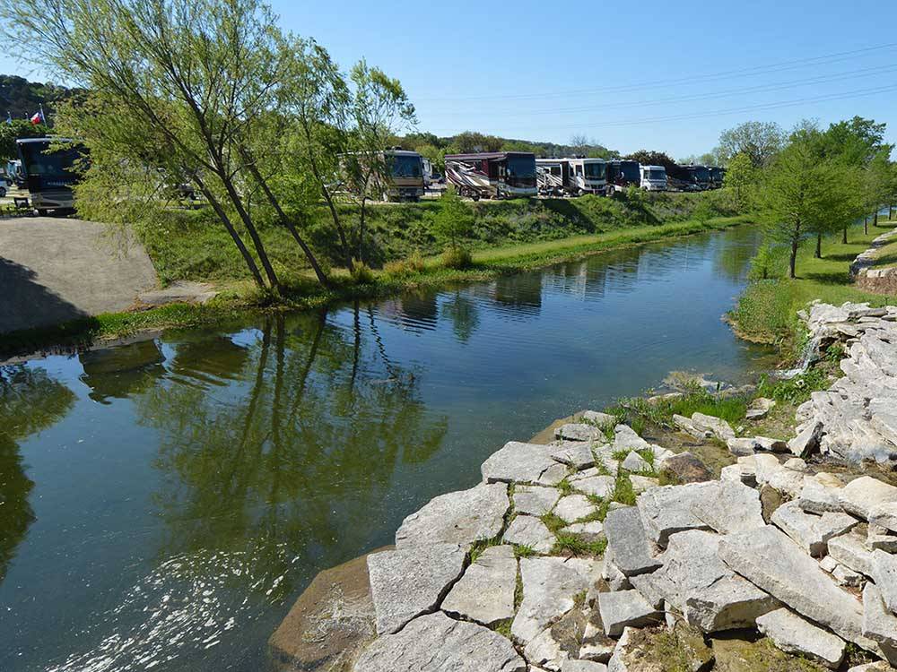 A waterway running alongside of RV sites at BUCKHORN LAKE RESORT