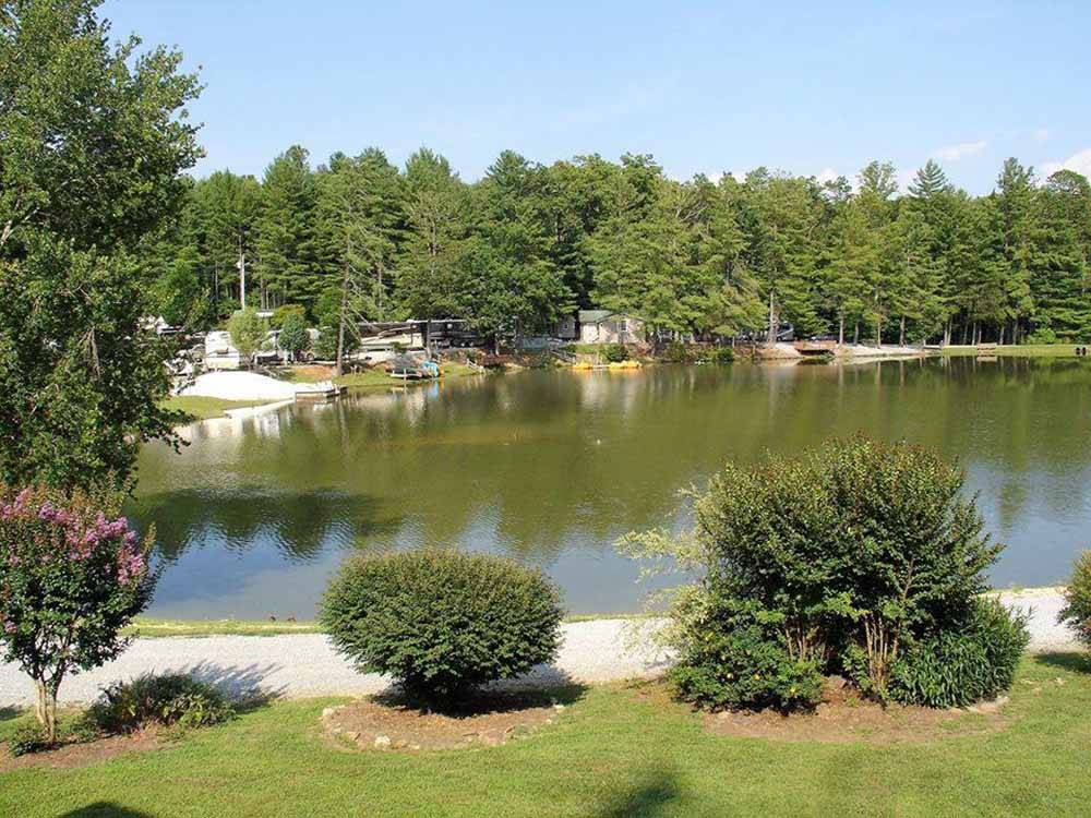 A view of the lake and RV sites at RUTLEDGE LAKE RV RESORT