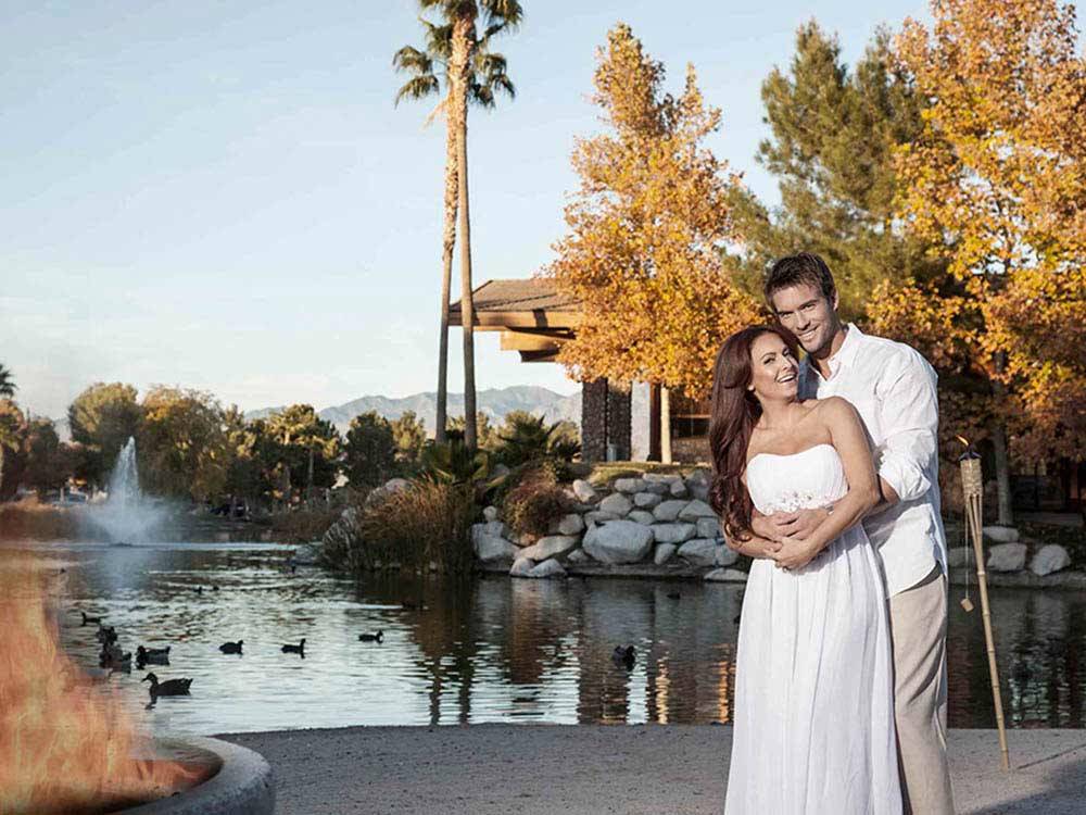 Newlyweds in front of lake at LAKESIDE CASINO & RV PARK