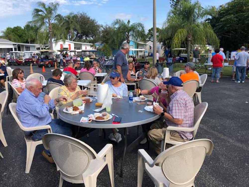 A large group of people eating at RAINTREE RV RESORT