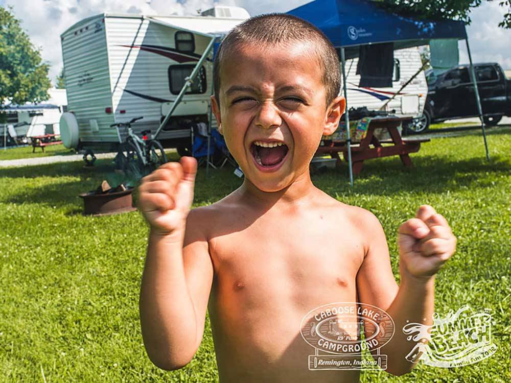 Young boy excited to be camping at CABOOSE LAKE CAMPGROUND
