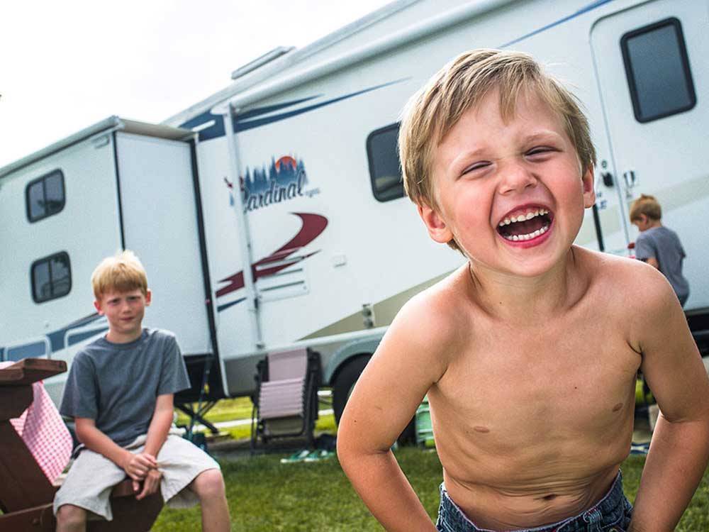 Kid at campsite at CABOOSE LAKE CAMPGROUND