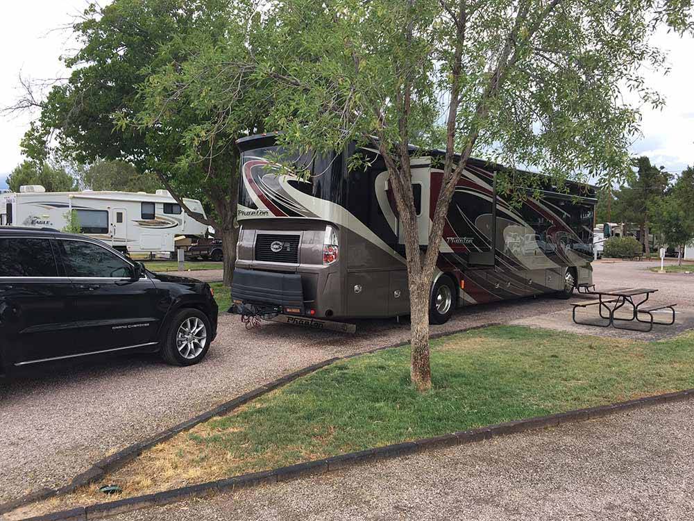 RVs and car and trailers camping at SUNNY ACRES RV PARK