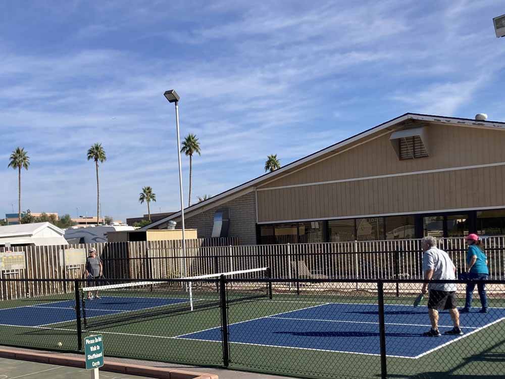 People playing pickleball at DESERT SHADOWS RV RESORT