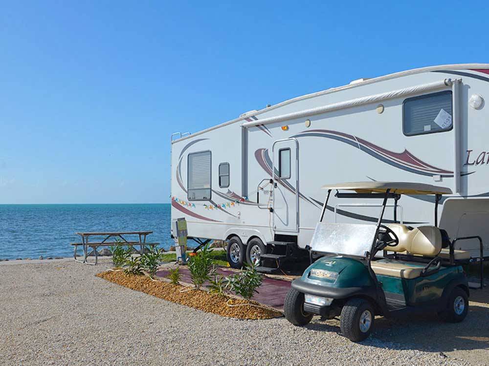 RV at campsite with ocean view at ENCORE FIESTA KEY
