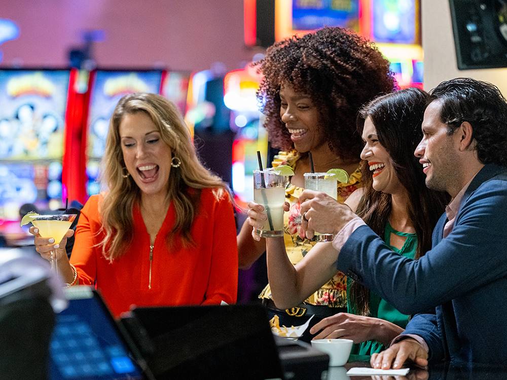 Couples playing the slot machines at FUN TOWN RV PARK AT WINSTAR