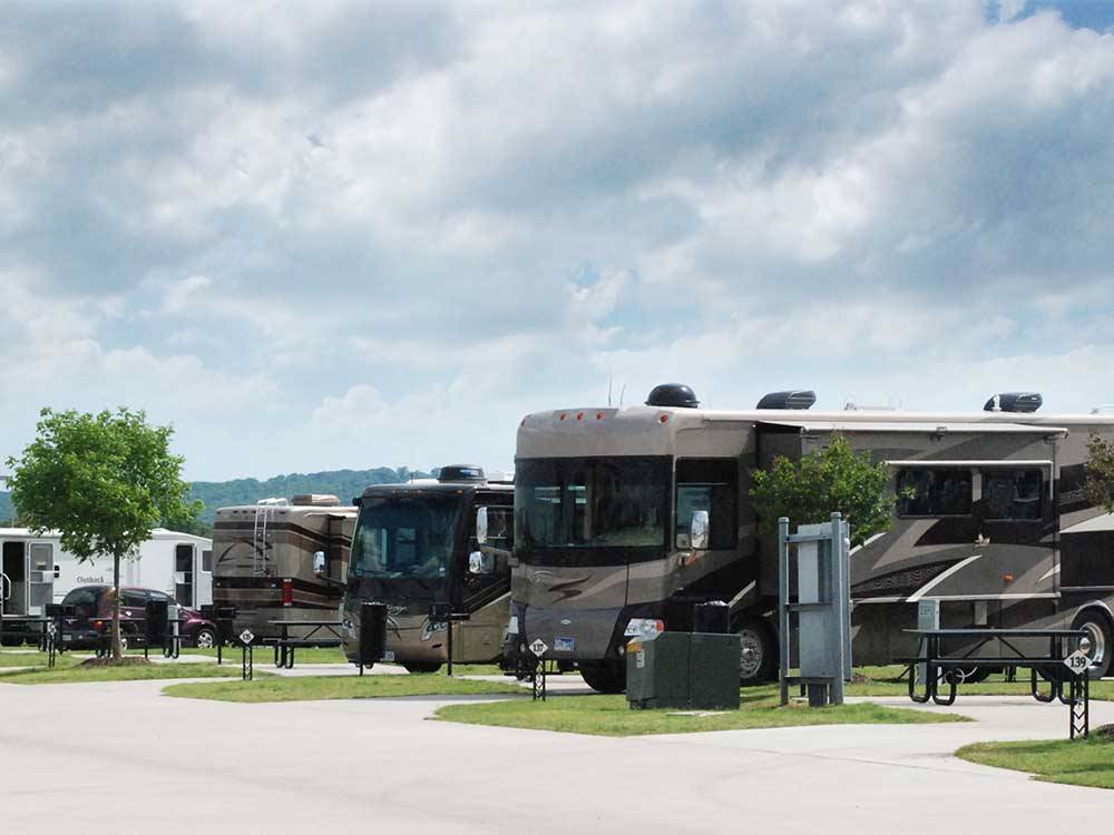 A row of Motorhomes parked in concrete sites at FUN TOWN RV PARK AT WINSTAR
