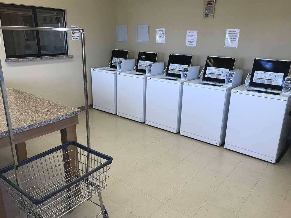 Laundry room with washers at QUAIL RUN RV PARK
