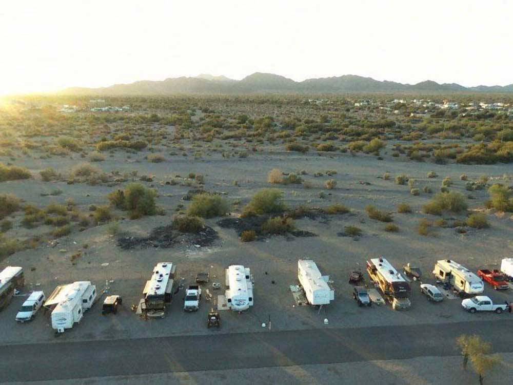 Aerial view over desert with trailers and motorhomes at QUAIL RUN RV PARK