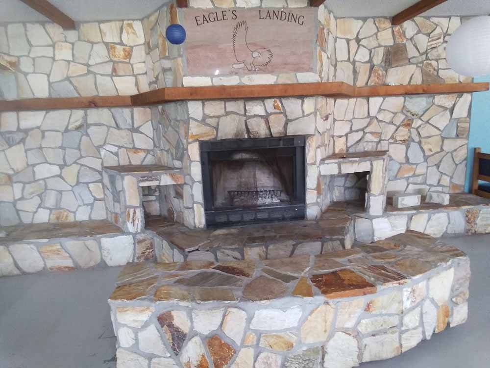 An inside brick fireplace at CECIL BAY RV PARK
