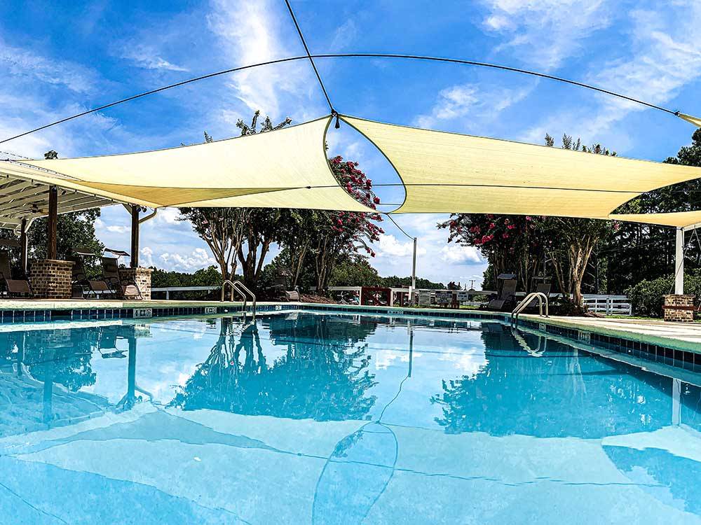 The shaded swimming pool at RED GATE FARMS - RV RESORT