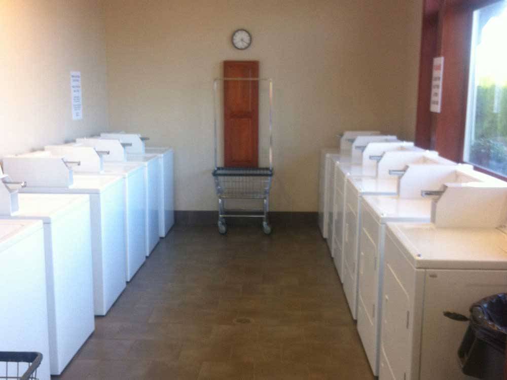 Laundry room with washer and dryers at HEE HEE ILLAHEE RV RESORT