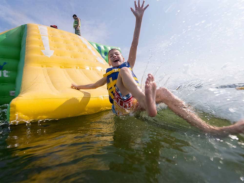 A child having fun on a water slide at NASHVILLE SHORES LAKESIDE RESORT