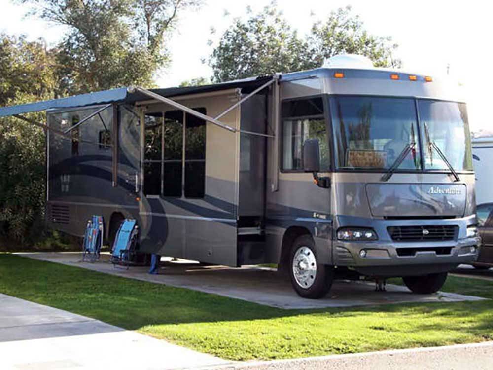 RV at campsite at INDIAN WATERS RV RESORT & COTTAGES