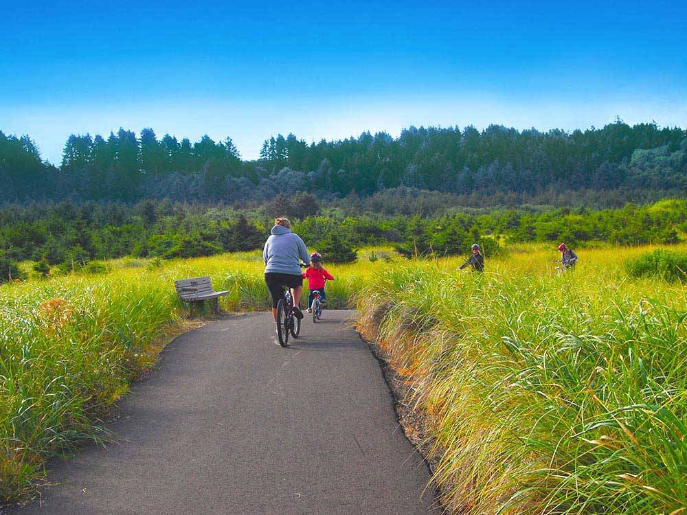 Mother and daughter biking at THOUSAND TRAILS LONG BEACH