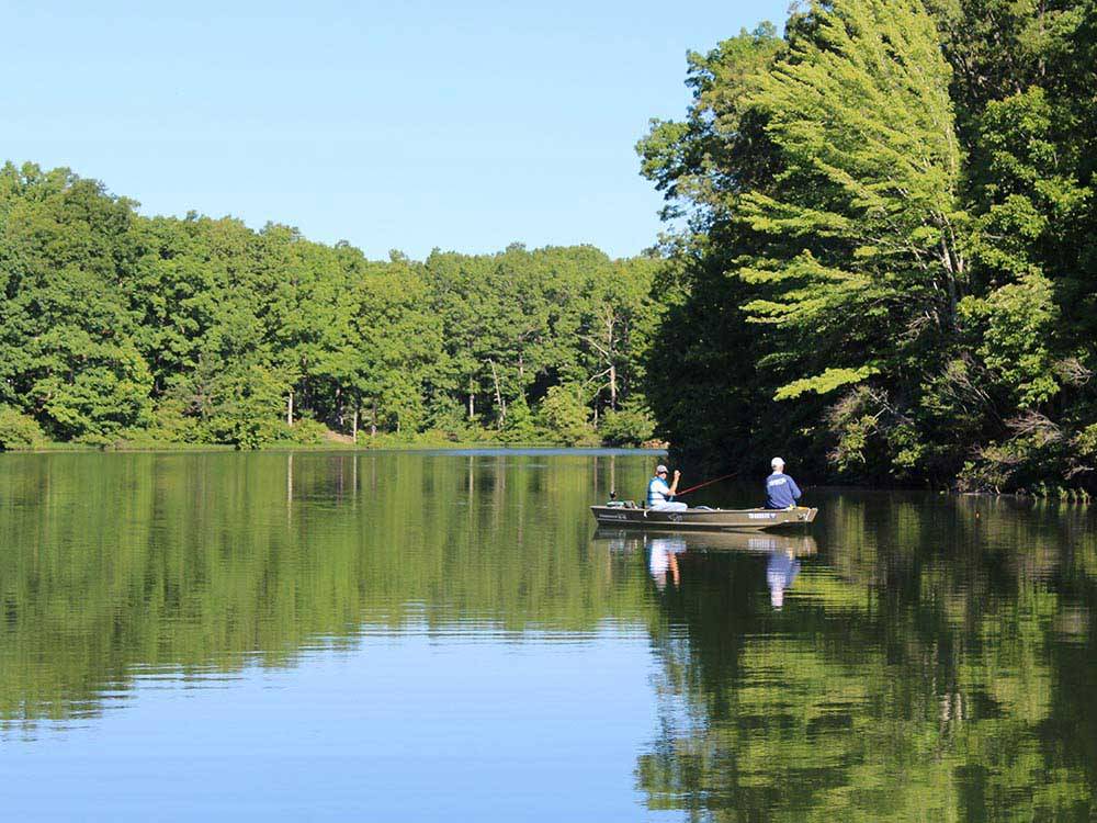 Men fishing in a boat on the lake at THOUSAND TRAILS NATCHEZ TRACE