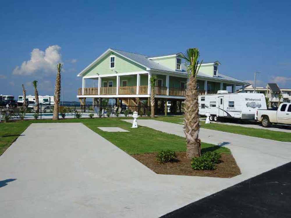 A couple of paved back in RV sites at PENSACOLA BEACH RV RESORT