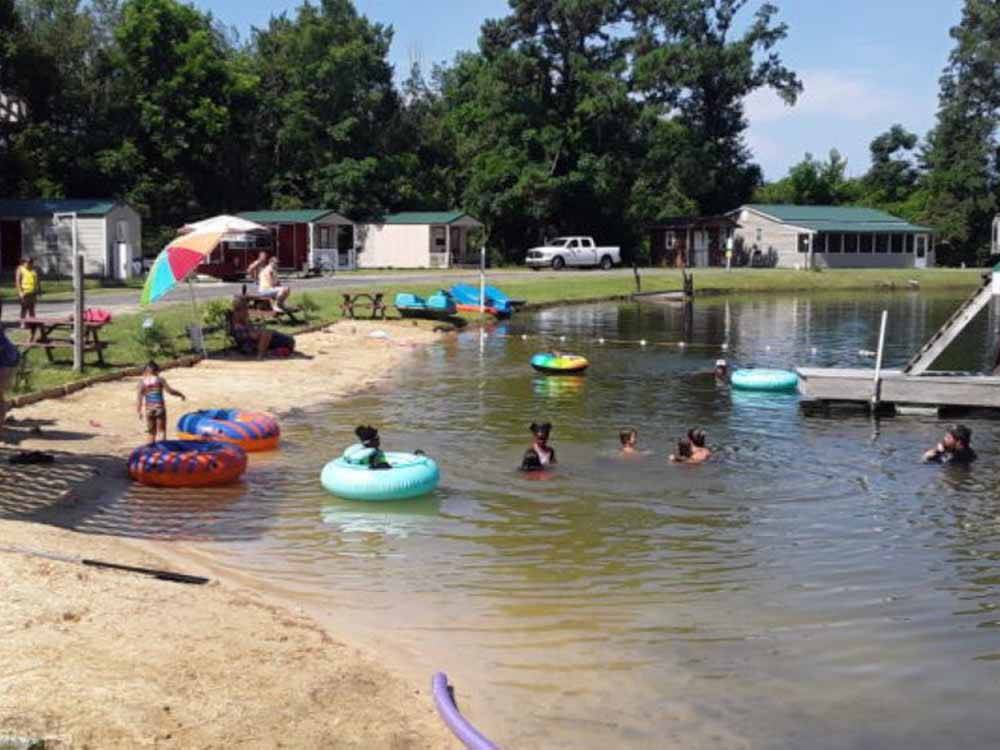 The lake is a perfect place to relax with family members and friends on a hot day at BEAVER RUN RV PARK