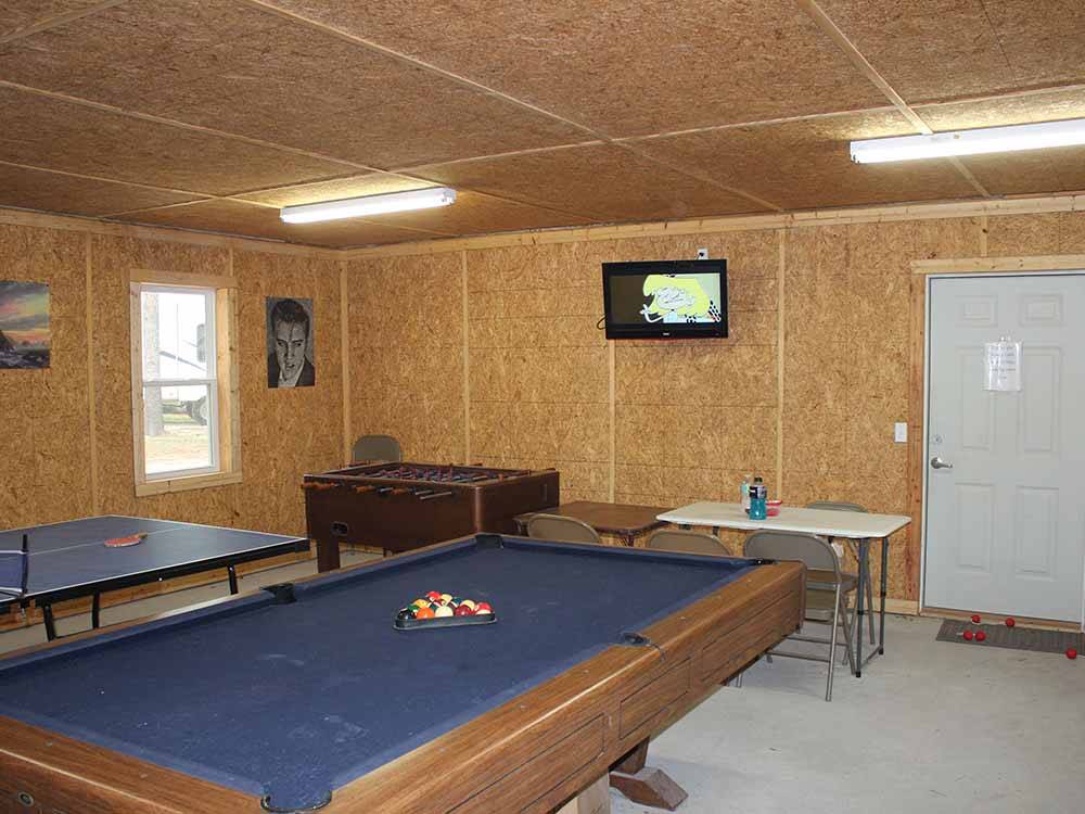Our game room includes pool, ping pong, and foosball tables at BEAVER RUN RV PARK