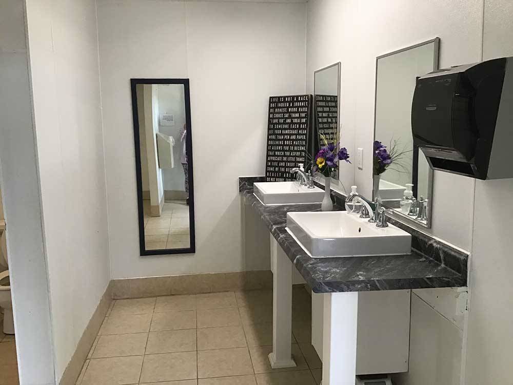 The restroom sinks and mirros at BEAVER RUN RV PARK